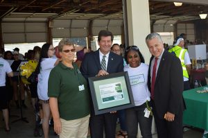 From left: Cazenovia Recovery Executive Director Sue Bissonette, County Executive Mark Poloncarz, emcee Venus Wiggins, and Commissioner Michael Ranney